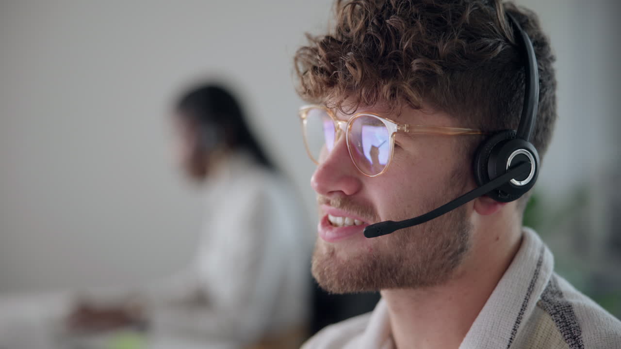 A man with a headset providing customer service