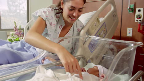 mother with newborn baby in hospital bed shot on r3d