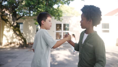 friends hugging each other in schoolyard