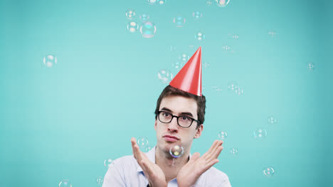 Crazy-face-man-dancing-in-bubble-shower-slow-motion-photo-booth-blue-background