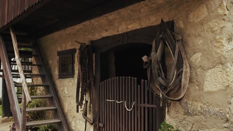 old stone stable with horse harness