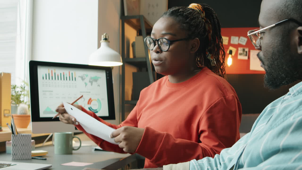 African American Coworkers Discussing Business Plan
