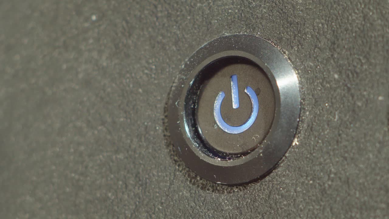 A close macro shot of a screw being slowly rotated into a metallic surface. Suitable for industrial, repair or minimal motion footage