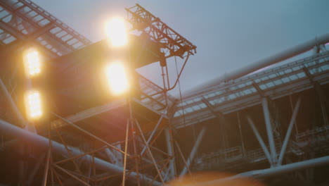 turning on and off stage lights at the concert outdoor in the dusk