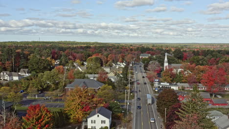 wells maine aerial v12 drone fly above route 1 highway passing through small town on post road capturing congregational church and countryside homes with beautiful autumnal trees - october 2020