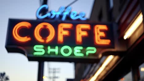 a vibrant neon coffee shop sign glowing in the twilight, highlighting the cozy atmosphere and inviting vibes of a local café with a unique character