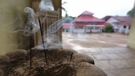 Slow-motion-incense-burning-in-a-temple-courtyard