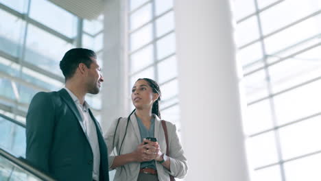 Office,-businessman-and-woman-on-an-escalator