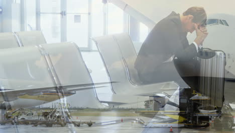 avión volando contra un hombre de negocios estresado sentado en la sala del aeropuerto