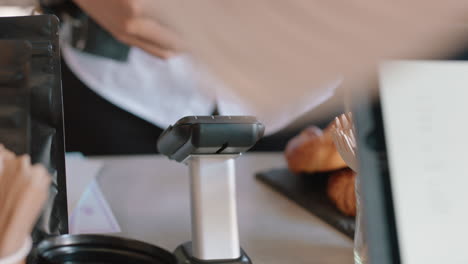 close up customer paying using smartphone buying coffee in cafe happy customer enjoying service spending money at restaurant