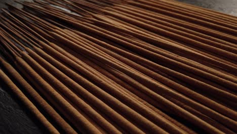 group of incense sticks on dark background