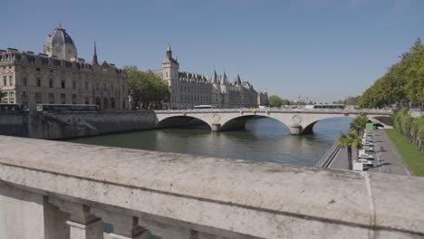 Wider-Angle-Shot-Of-Pont-Saint-Michel-Bridge-Crossing-River-Seine-In-Paris-France-With-Tourists-And-Traffic