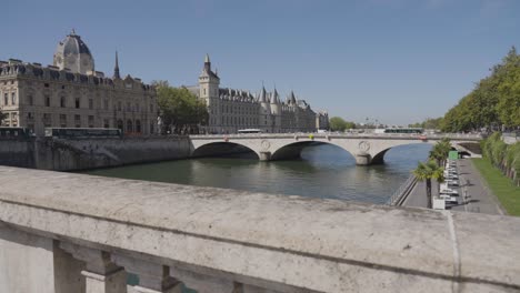 wider angle shot of pont saint michel bridge crossing river seine in paris france with tourists and traffic