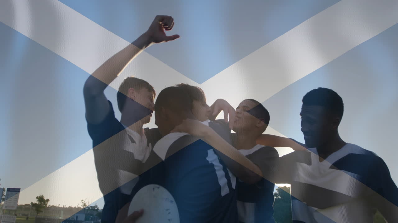 Animation of flag of scotland over diverse male rugby players celebrating