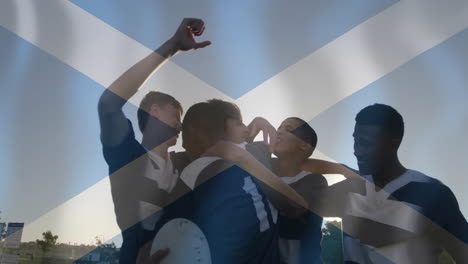 animation of flag of scotland over diverse male rugby players celebrating