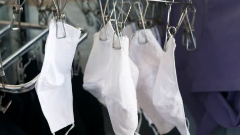 selective focus of washed white cloth masks to dry outdoors after a week of anti covid-19 use