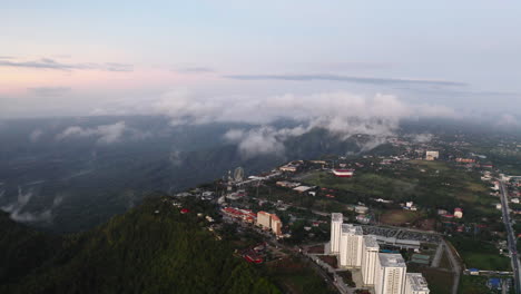 Aerial-footage-of-an-amusement-park-built-on-top-of-a-mountain-plateau