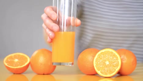 freshly squeezed orange juice in a glass on a table stock video stock footage