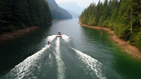 man wakeboarding with motorboat in the river 4k