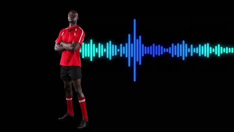animation of african american male athlete standing arms crossed over soundwave on black background