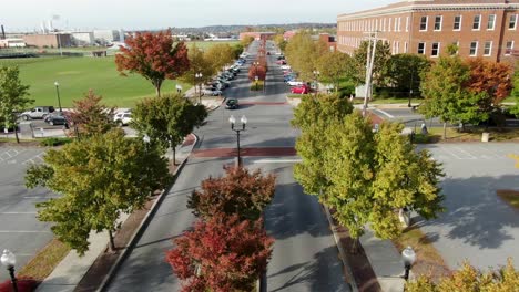 Aerial-dolly-shot-approaching-road-and-sidewalk-intersection