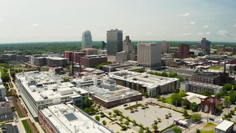 an orbiting drone shot of the winston-salem skyline in north carolina in the summer