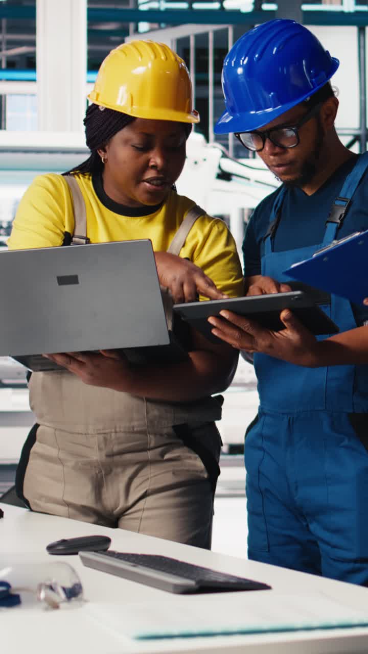Vertical Video Technicians group in photovoltaics factory use tracking software on devices