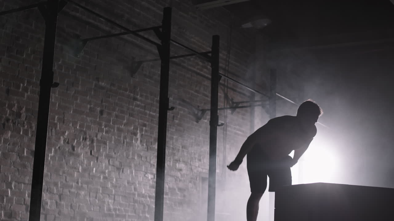 Silhouette of Determinate Sportsman Having Intensive Training