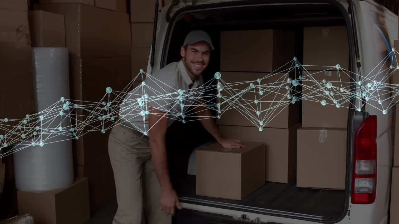 Delivery worker arriving van unloading and wrapping boxes for shipment smiling holding smartphone
