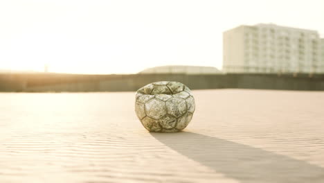 very old soccer ball on the playground