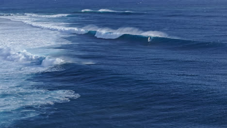 surfing huge waves in the ocean