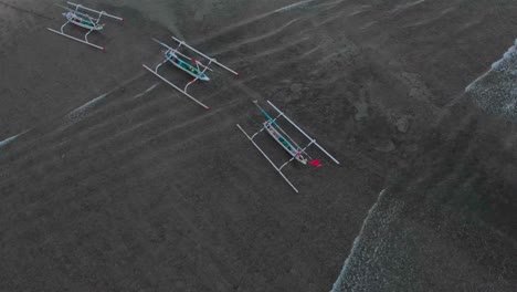 Top-down-view-of-Amed-beach-Bali-with-fishing-boats-on-shore