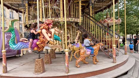 colorful carousel with various animal and vehicle seats