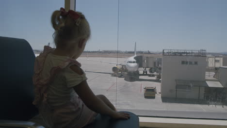 watching planes makes her waiting more interesting