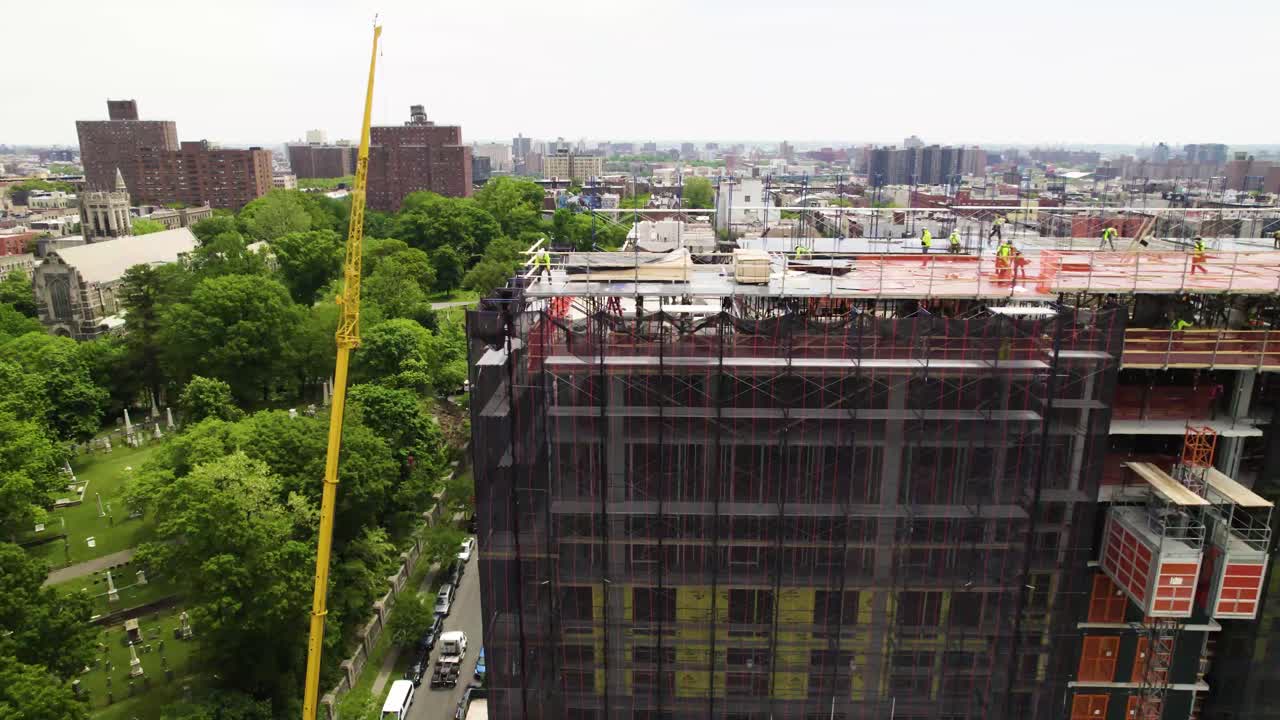 Construction crew at work atop a NYC high rise development