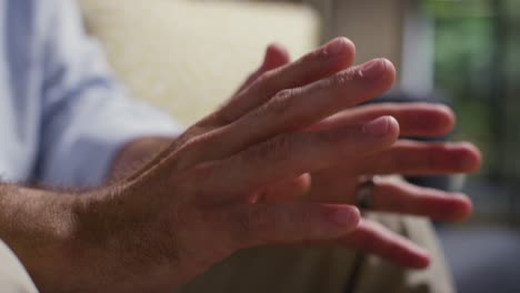 close up of mature man talking with counsellor about general or mental health issue