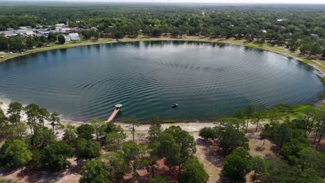 aerial view of lake defuniak - almost perfect circular lake in defuniak springs, florida