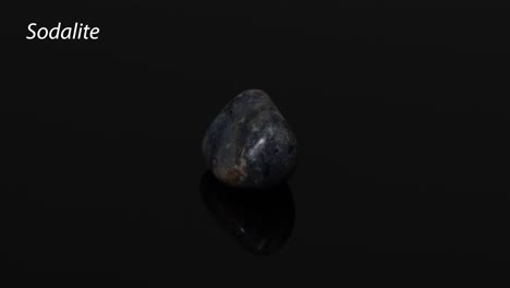 sodalite stone rotating on a reflective surface