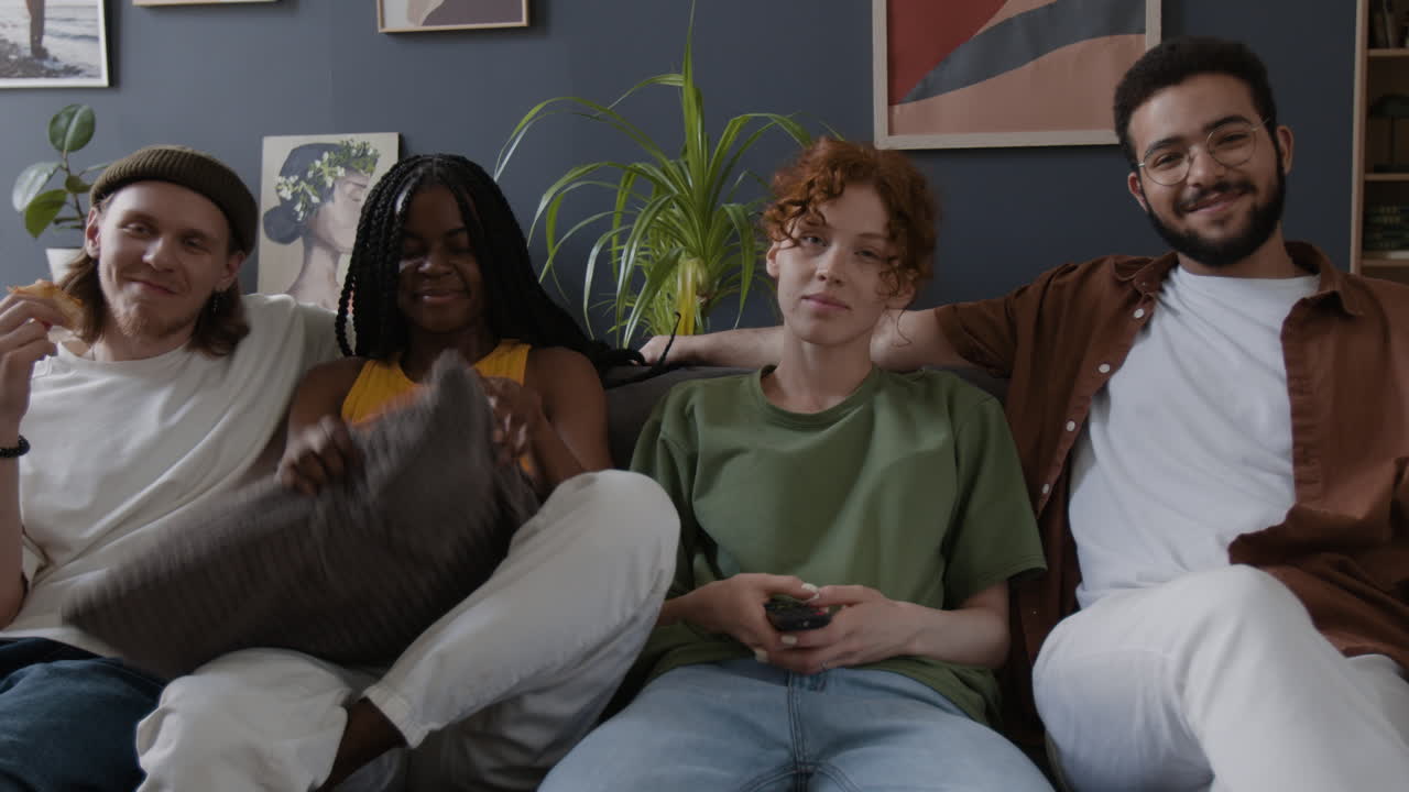Friends Relaxing on a Couch in a Living Room