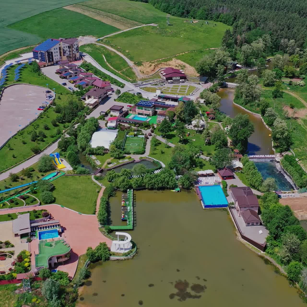 Modern recreation complex. Beautiful green territory of popular recreational center for outdoor weekend in summer. Aerial view.