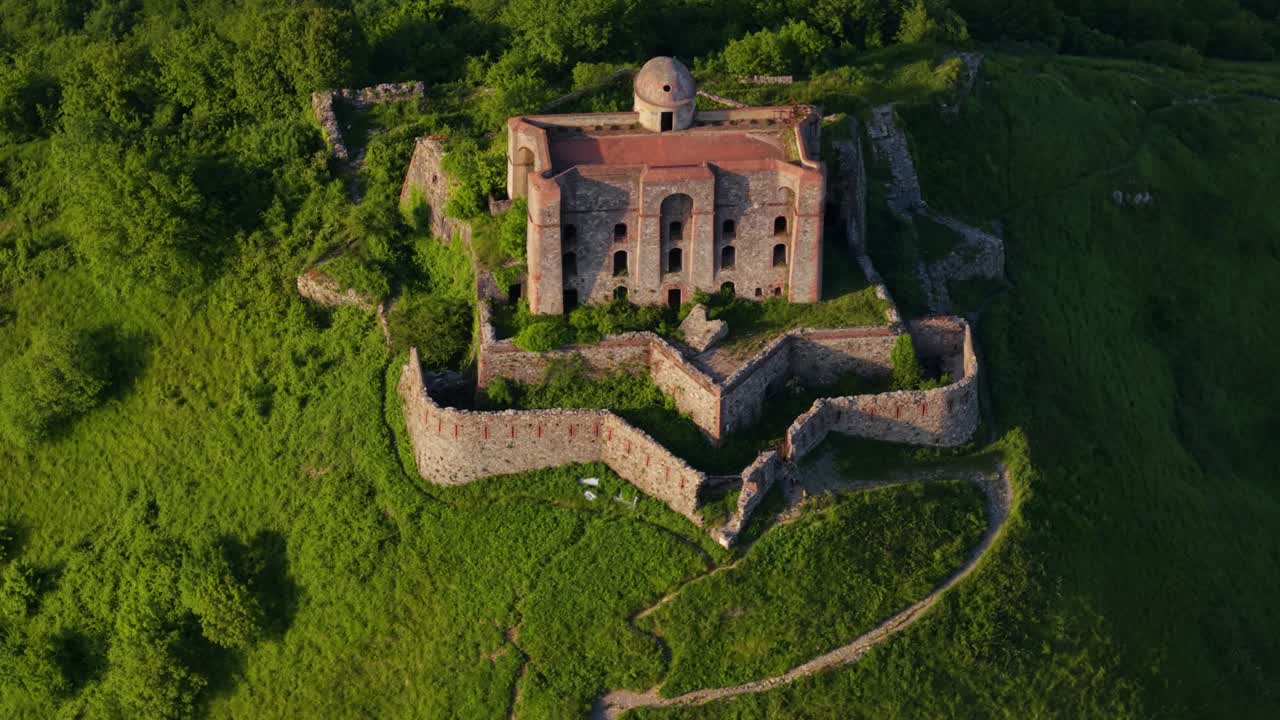 Ancient fort in Italy surrounded by greenery and walls, giving a peaceful vibe