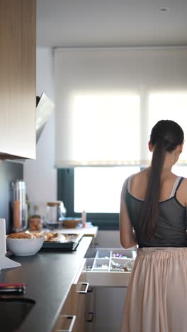 woman preparing food in a modern kitchen