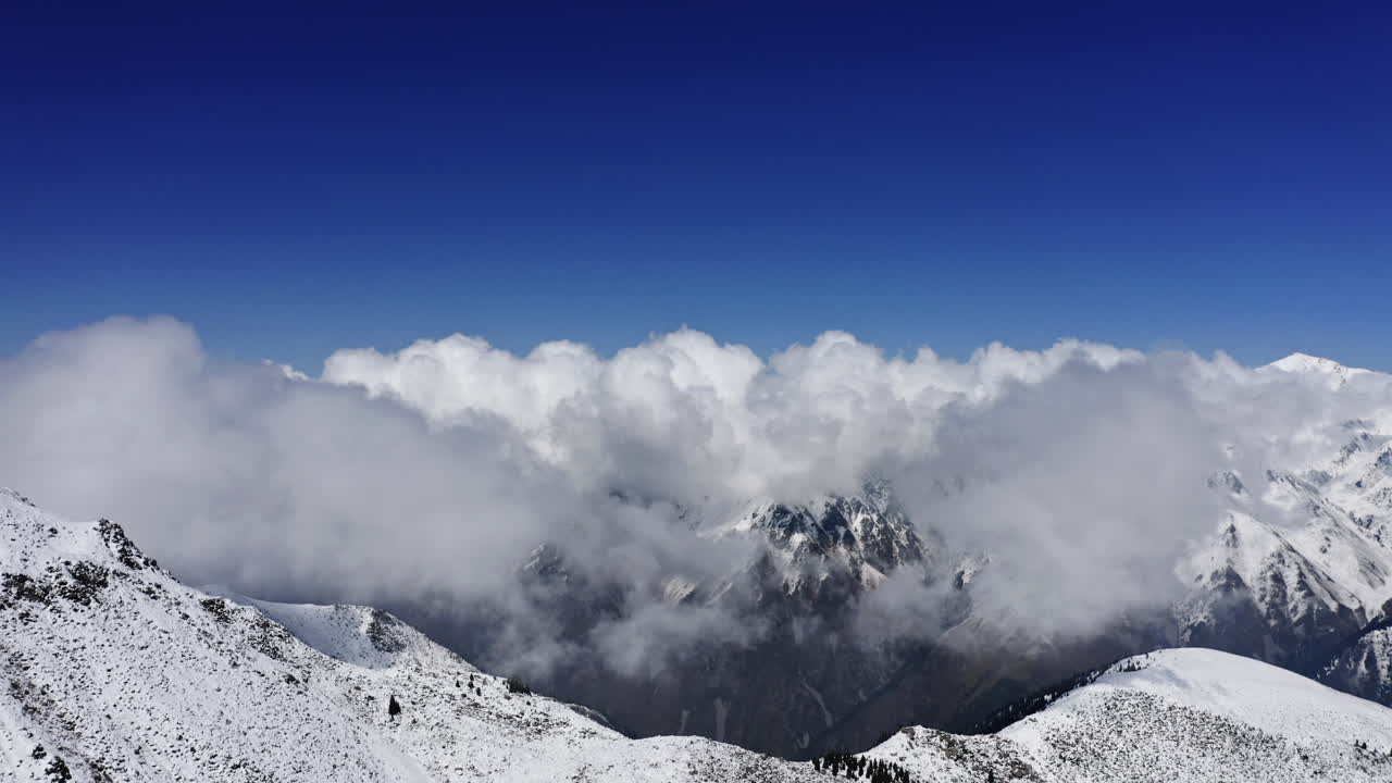 Beautiful clouds above the snowy mountain