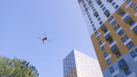 drone flying over apartment buildings