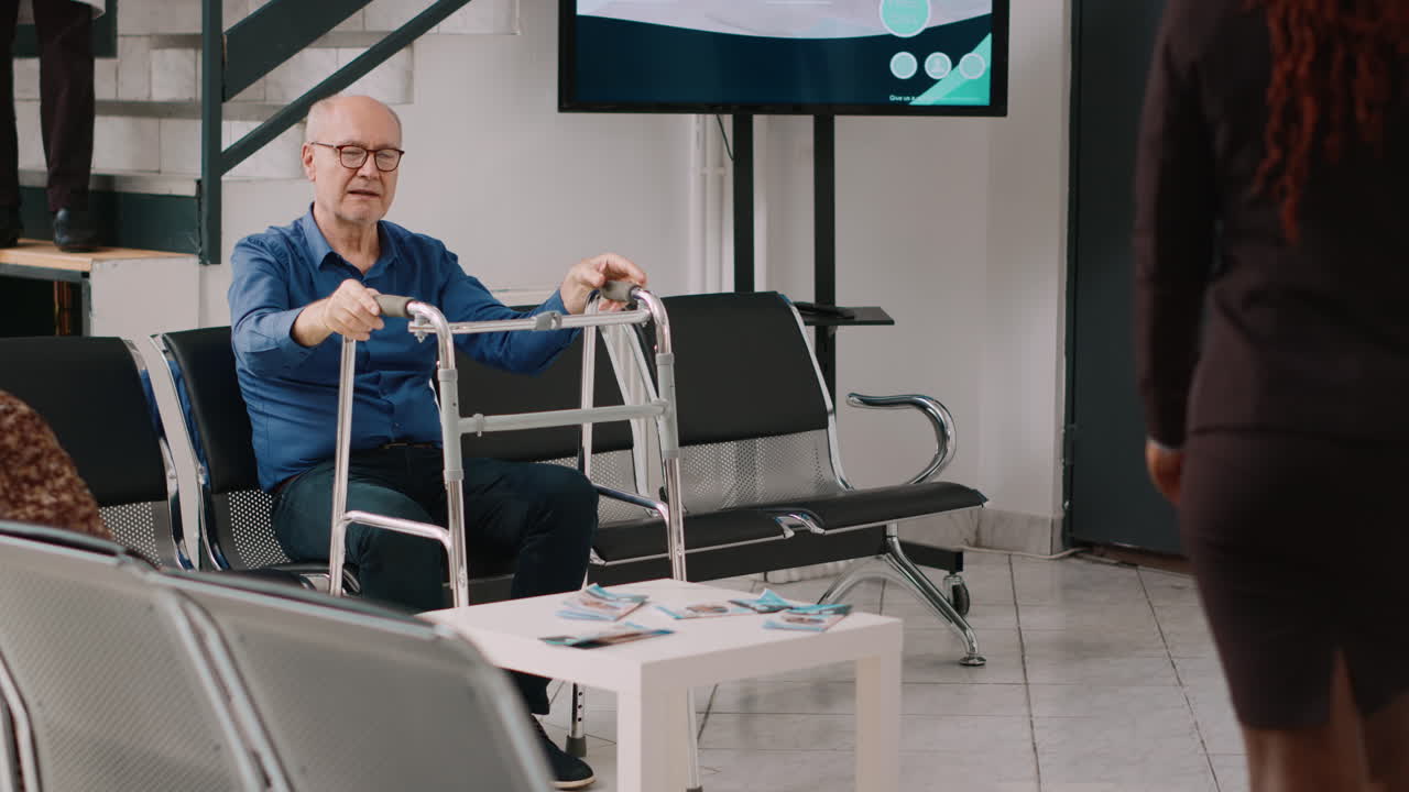 Senior patients sitting in waiting room at health center