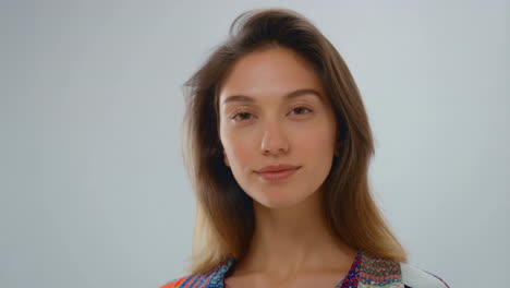 close-up portrait of a young woman with a slight smile