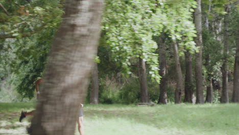 fit couple running and jogging in the park