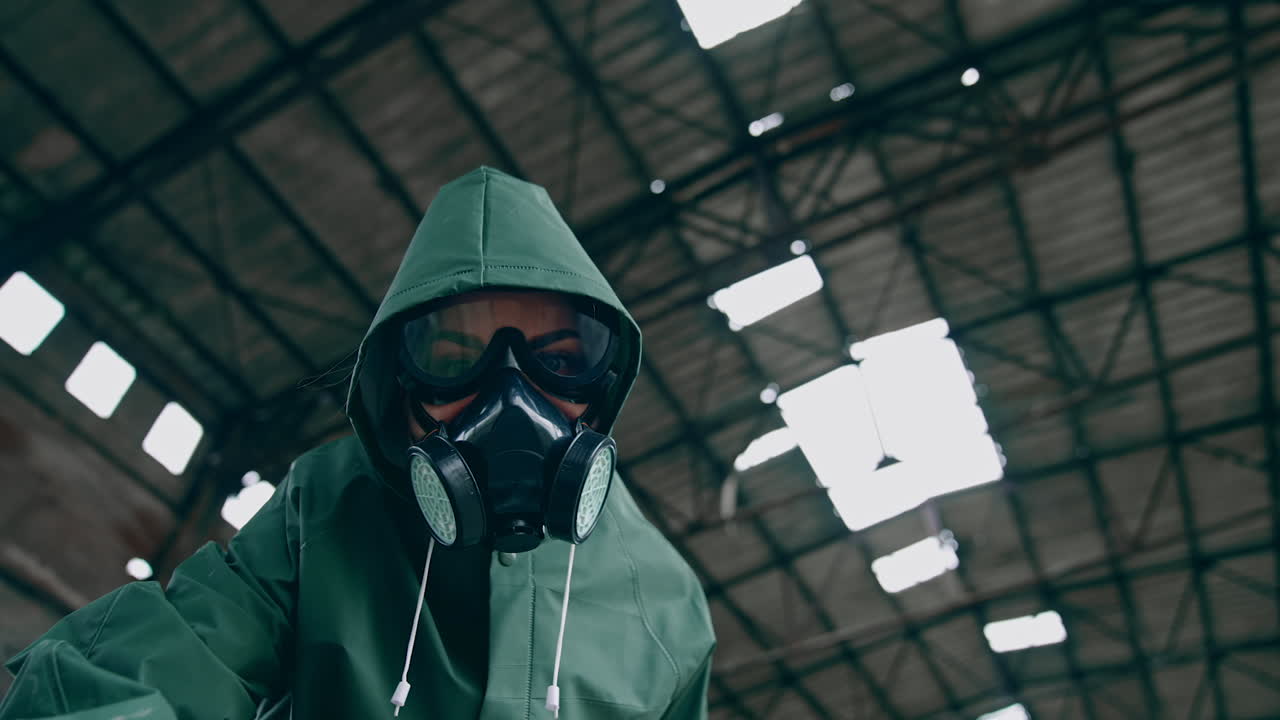 Man in chemical protection. Man in respirator against nuclear background