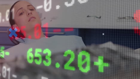 female patient wearing dental bib reclining in chair, showing floating stock market numbers overlay