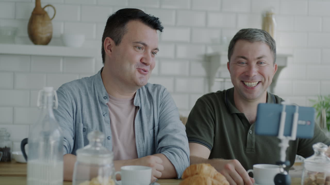 Two Men Recording a Video Blog in the Kitchen